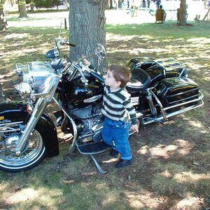 Boy checking out a bike, 2005.