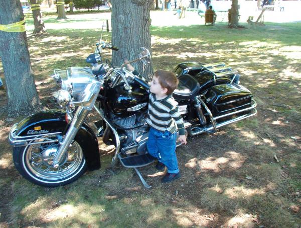Boy checking out a bike, 2005.