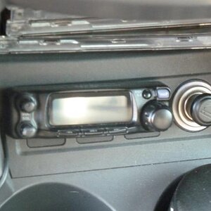 Detachable front panel of FT90R mounted under dash.