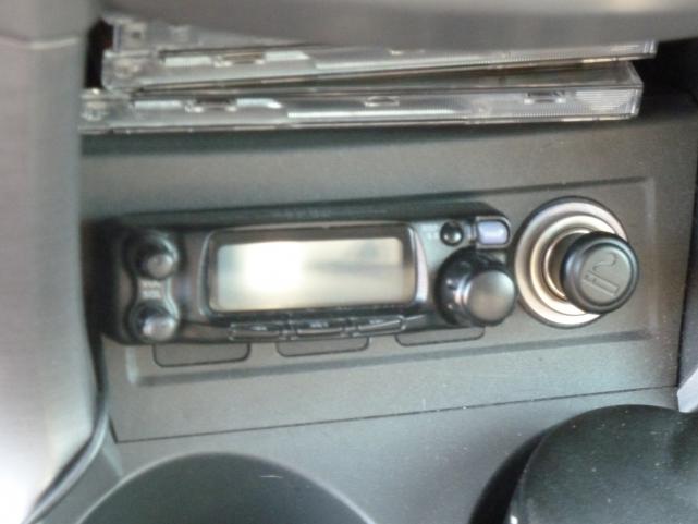 Detachable front panel of FT90R mounted under dash.