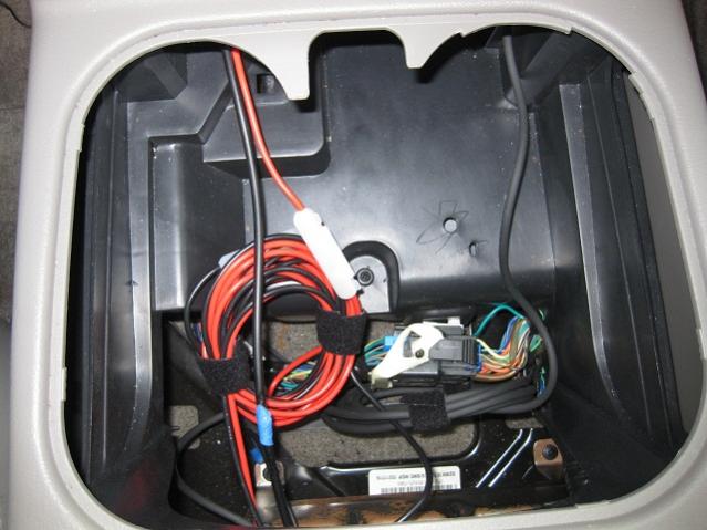 Wires stored in center console. Easy access if needed.