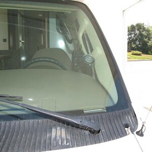 View of Yaesu VX-8r from outside with tiny 2m/440 antenna on the RV sheet metal