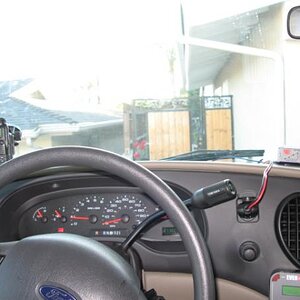Picture of the dash with Yaesu VX-8r and 2 meter amplifier
