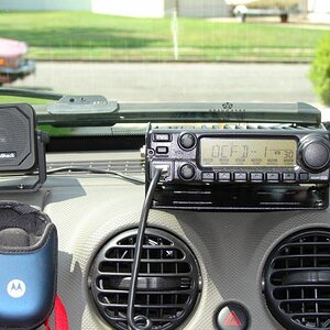 A closer look...the Motorola cell phone pouch is velco'ed to the dash, and holds my phone while driving.....