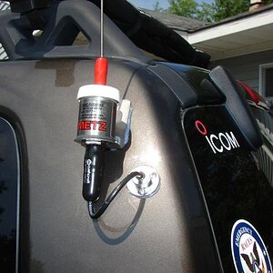 Close up of Metz 2 meter mobile antenna installation on my '05 Jeep Liberty. Used a marine fitting to run the coax through the metal body inside the v