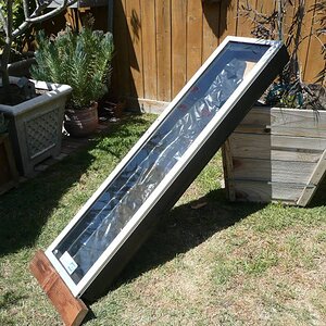 Making a new solar 'collector' from a discarded 'doggy door' insert (from a sliding glass door cut down to 54"x15"). The box is constructed from 2 x 4