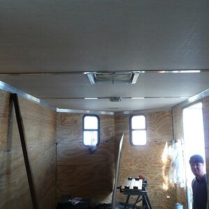 Installing insulation and luan paneling in the 'V'-nose trailer