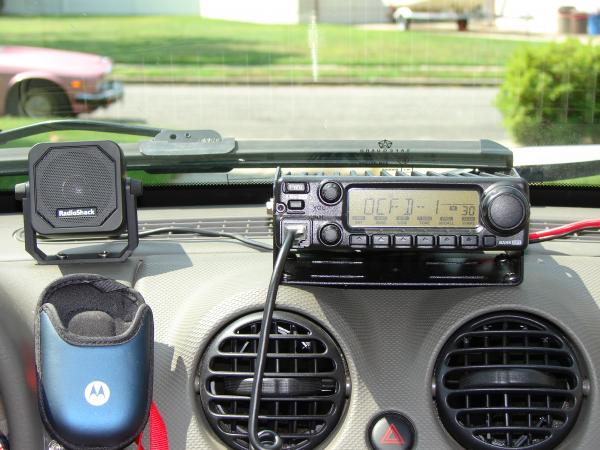 A closer look...the Motorola cell phone pouch is velco'ed to the dash, and holds my phone while driving.....