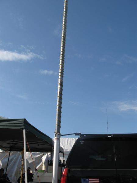 Air pressure driven mobile mounted mast