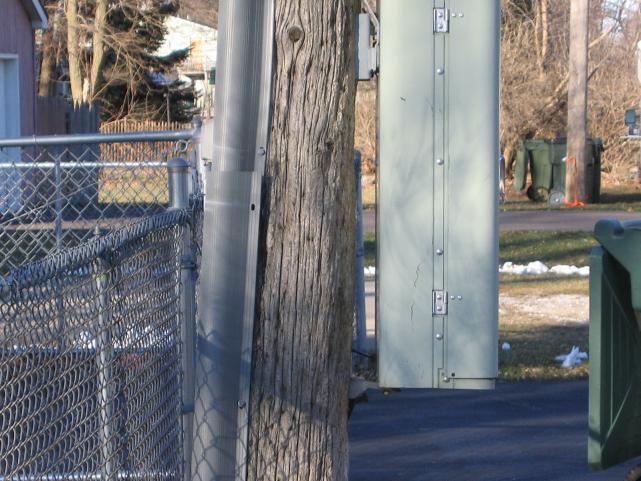 AT&T and everyone's grandma is constantly out here screwing with this pole box. See where the gray cove is pulled away from the pole & the screws miss