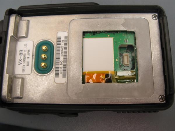 Back of radio with cover lifted off.