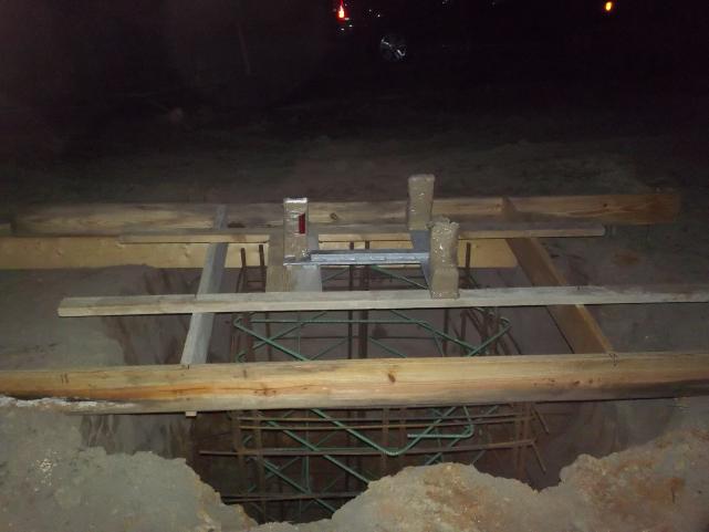 base formed in and tower base suspended over rebar