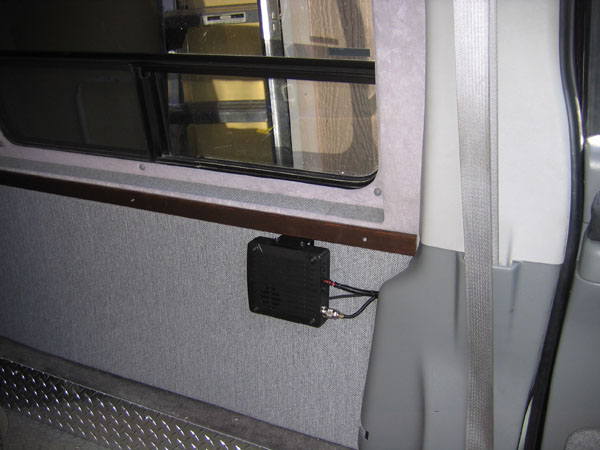 Chassis mounted on wall just behind the driver.