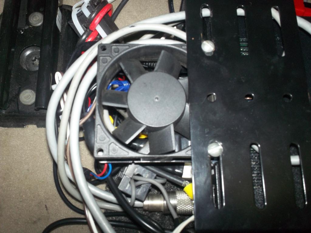 External Cooling fan mounted over rear heat sink fins.