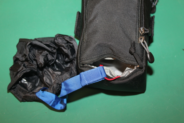 Extra compartment for rain cover or wire