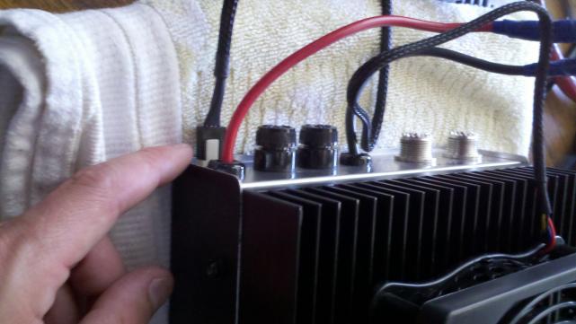 finger pointing at fan plug.