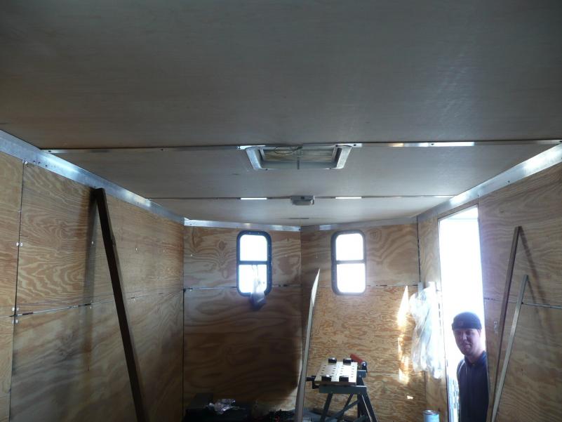 Installing insulation and luan paneling in the 'V'-nose trailer