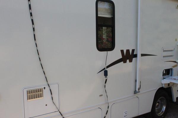 Ladder line to a 1:1 current balun to a short piece of coax attached to the LDG AT-897 tuner.