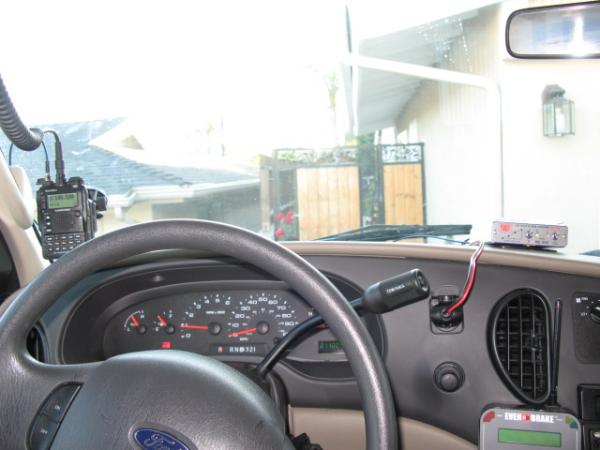 Picture of the dash with Yaesu VX-8r and 2 meter amplifier