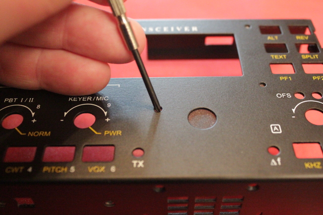 Removing the vinyl tape by punching it through