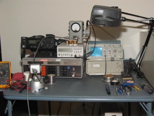 Tech bench: small but effective.  Marconi 10khz - 520Mhz signal generator, Fluke PM6666 1.3GHz Frequency couter, Tektronix  2336 100Mhz O-scope, Bird 