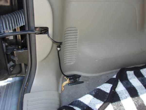 The hinge opening at the rear door gave me a convenient place to fish the coax out and run it to the dash....