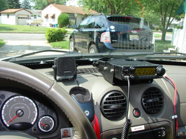The IC-2200H on the dash with the Rat Shack mini extension speaker next to it. View from the driver's seat....