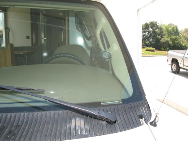 View of Yaesu VX-8r from outside with tiny 2m/440 antenna on the RV sheet metal