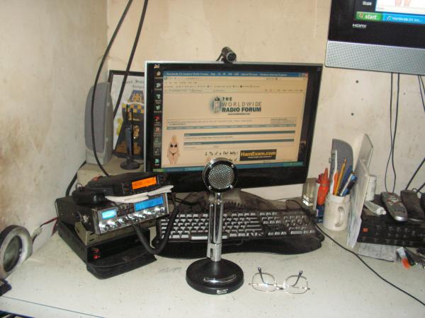 You can just see the corner of my 42" widescreen out her in my shack.  Magnum OmegaForce & Astatic D-104/TUP9, Yaesu FT-8800R